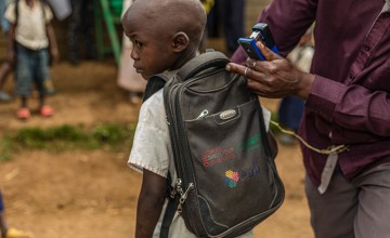 Baraka, 5 years old, in primary school in DRC washes his hands before entering the classroom. Photo: Pamela Tulizo