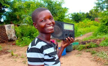 Grace, 26, with her radio at her home in Mlolo, Malawi. Photo: Jason Kennedy / Concern Worldwide