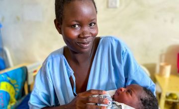 Saline Atieno holding Cynthia who was just born today. Saline came to Korogocho Health Centre to give birth as part of the antenatal programme she attends here. Nairobi, Kenya Photo: Jennifer Nolan