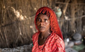 Subbi (28) works with her husband as labourers in a field during harvest season, while her children stay at home.