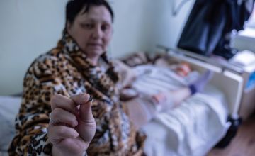 Ina Trofimenko, 47, holds a piece of shrapnel that injured her. Photo: Stefanie Glinski/Concern Worldwide