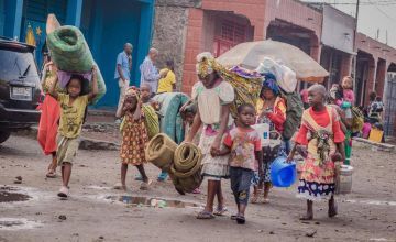 A family flees the volcanic eruption in Goma and heads to Sake village. Photo: Esdras Tsongo/Concern Worldwide