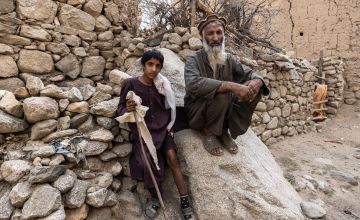 12-year-old Najib* and his father Fawad* (47) in their village in Afghanistan.