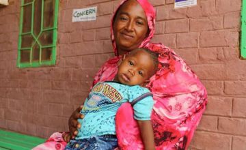 Abda and her son, outside a hospital in Sudan