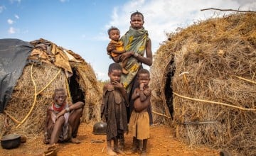 A woman in drought-plagued Turkana, Kenya with her children and mother-in-law