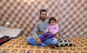 Khalid is pictured with his two-year-old daughter, Lebanon. Photo: Darren Vaughan