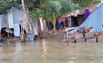 Damaged houses after severe flooding in Sunamganj, Bangladesh.
