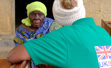 Christine tells her story to one of Concern's Protection Officers in Oicha, DRC.