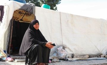 Eflin* outside her temporary home in southwest Türkiye. Photo: Yasin Almaz/Concern Worldwide
