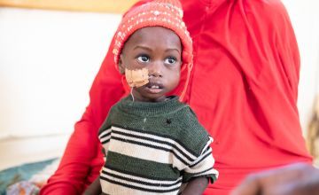 21-month-old Zanadiya is cared for by her mum inside the Concern-supported intensive nutritional recovery centre