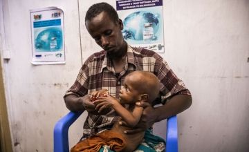 Ali* (38) and his son Jama* in the Obosibo Halane Health Centre In Wadajir District , Mogadishu, supported by Concern Worldwide. Photo: Ed Ram/Concern Worldwide
