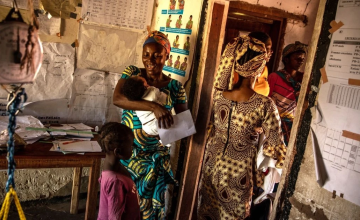 Nurse Leonie Kamono (on left), 37, at Kiambi Heath centre, Manono Territory. Leonie works at the tiny health centre that provides services for the community of the town of Kiambi and the wider region, she also looks after her own eight children. ‘I consult pregnant women, assist them with childbirth, act as a midwife and do consultations’, explains Leonie.