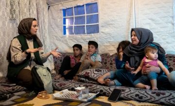Hatice with Darine* and her family who lost everything in the earthquake and now live in a tented shelter. Photo: Gavin Douglas/Concern Worldwide
