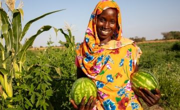 Mahadia Gamar (24) showcases her watermelon at her farm in Karo village. Photo: Eugene Ikua/Concern Worldwide