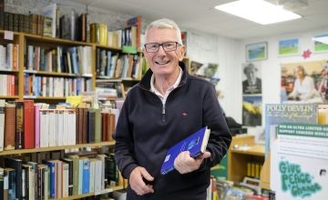 Volunteer Richard, inside Concern's bookshop in Holywood, Co Down.