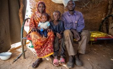 Bahar* (40) and his family, his wife Arafa* (30), who is holding their youngest child, Abakar* (2) and Mahamad* (8). Photo: Eugene Ikua/Concern Worldwide
