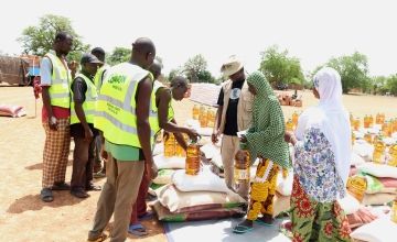 Concern staff distribute food kits to families in Koupéla, Burkina Faso. The country's location in the Sahel means it's used to year-round heat, but it faced an extreme and deadly heat wave earlier this year.