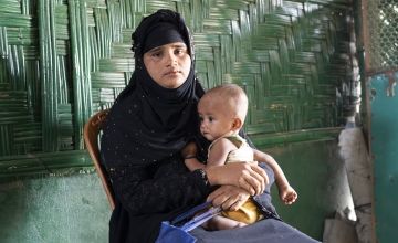 Ayesha* and Anwar* at the nutrition centre in Cox’z Bazar, where Anwar was assessed as malnourished and given ready to use therapeutic food.