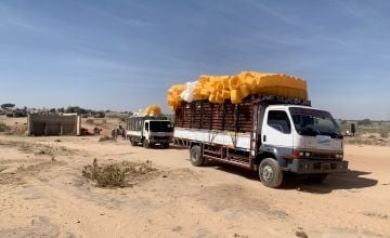 Concern trucks transport supplies across the Chad and Sudan border. Photo: Johannes Davies/Concern Worldwide