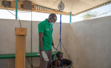 A child is weighed at the Concern health post in Baga Sola, Western Chad. Photo: Eugene Ikua/Concern Worldwide