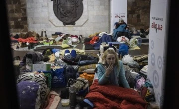 A woman sits on the floor in Heroiv Pratsi metro station in North Eastern Kharkiv. Photo: Ed Ram/Concern Worldwide