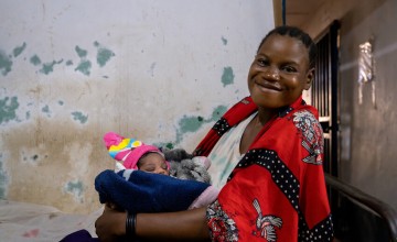 Elisa with her newborn daughter - her fifth child.
