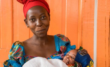 Esperance with her three week old daughter