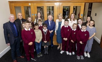 Pupils and teachers from Bunscoil Mhic Reachtain with Irish President Michael D Higgins and Sabina Higgins and Concern's Amelia Deehan
