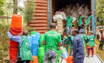 Concern staff members organise the distribution of household and hygiene kits as part of the SAFER programme, funded by FCDO. Photo: Samuel Isenge/Concern Worldwide