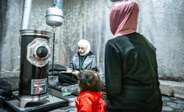 Concern Compliance Officer interviews a mother from Syria and now lives in Northern Lebanon. Photo: Gianluca Galli/Concern Worldwide.