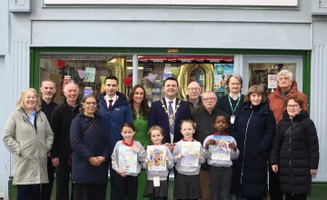 A group of people outside a bookshop