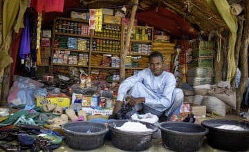 Ahmat, an income-generating activity (IGA) beneficiary under the RESPECCT programme, selling goods at Tondolo market. Photo: Kouakaine Moundi/Concern Worldwide.