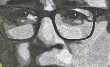 A close up of Andy Burnham's face drawn in greyscale on a field