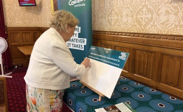 Baroness Goudie signing petition