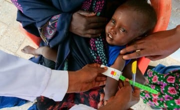 Mubashir age 2 is getting his MUAC measurements taken. Photo: Eugene Ikua/Concern Worldwide.