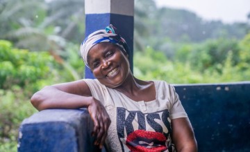 Mary is a farmer and a LIFE programme participant. Steady farming work has helped her feel more financially secure and enabled her to move from a rented thatched cottage into a iron sheet roofed home, Liberia. Photo: Eugene Ikua/Concern Worldwide.