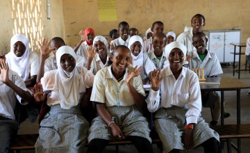 A classroom of happy junior school students