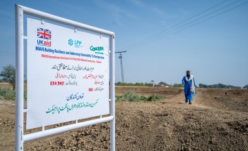 A UK Aid logo and a Concern Worldwide logo on a sign in Pakistan