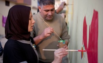 Tarek and Zeinah attend an art workshop with refugee families at a Concern supported Collective Centre in Northern Lebanon in December 2015. Zeinah and Tarek now live with their three children and two other families. Photo: Panos Pictures/Concern Worldwid
