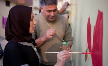 Tarek and Zeinah attend an art workshop with refugee families at a Concern supported Collective Centre in Northern Lebanon in December 2015. Zeinah and Tarek now live with their three children and two other families. Photo: Panos Pictures/Concern Worldwid