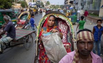 Nazma returns from selling food at local offices in Dhaka, Bangladesh. Photo: Abbie Trayler-Smith / Concern Worldwide. 