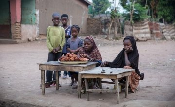 Children set up a stall to sell their wares to early morning passers-by in the town of Kouango,Central African Republic. Photo: Kieran McConville / Concern Worldwide