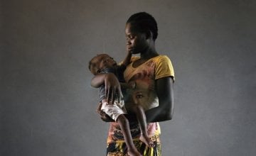 Elianna holds her daughter Laureine at Bossembele hospital. Laureine is 21 months old and severely malnourished. Concern organised transportation from her village to the hospital – the cost of which would be too high for most people.  Metadata report