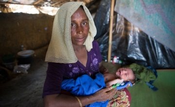 Shaju (name changed for security) with her day-old daughter in her shelter at Moynardhona refugee camp, Cox's Bazar. She says: "In Myanmar there was killing and fighting - here there is peace." Photo: Kieran McConville/Concern Worldwide.