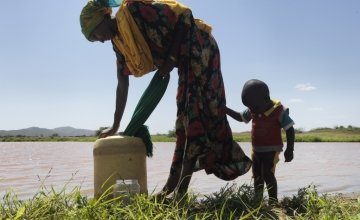 25-year-old Rufo Galgallo and her son 18-month-old Nura collect water twice daily from a nearby dam. The mother-of-three receives advice on good hygiene and a regular supply of water purification tablets from a Concern-supported community outreach program