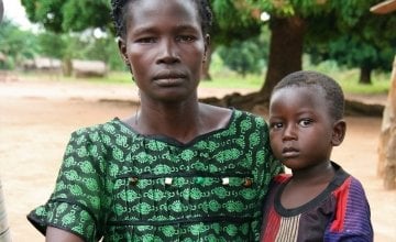  Beatrice* with her son, Robert*. Like thousands of others, Beatrice fled with her family to DRC when rebels attacked her village.