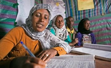 Tasam Haileselasie is the chairwoman of the Savings & Credit Co-Op in Megera in Northern Ethiopia. She tracks contributions and withdrawals of local micro-loans, which allow villagers to borrow three times their savings. Photo: Kieran McConville