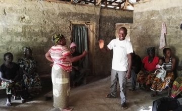 A couple acting out a role play as part of a gender transformational session with couples in Sierra Leone. Photo by Adèle Fox, December 2017