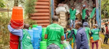 Concern staff members organise the distribution of household and hygiene kits as part of the SAFER programme, funded by FCDO. Photo: Samuel Isenge/Concern Worldwide