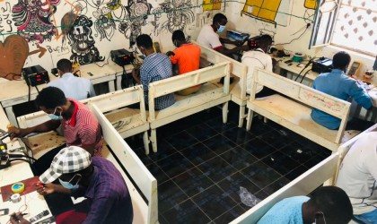 Mobile phone repair students doing a practical activity under Danwadaag programme, March 2021. Photo: Yusuf Mah / Concern Worldwide.